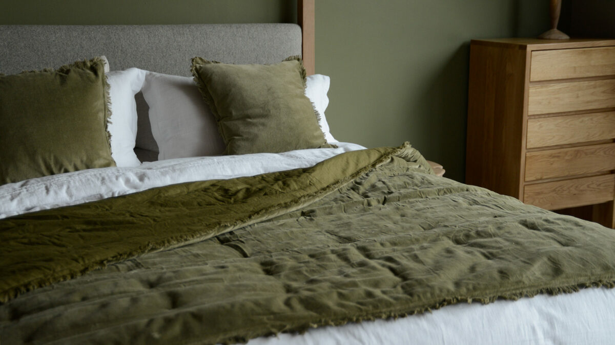 deep olive reversible velvet quilt and matching cushions