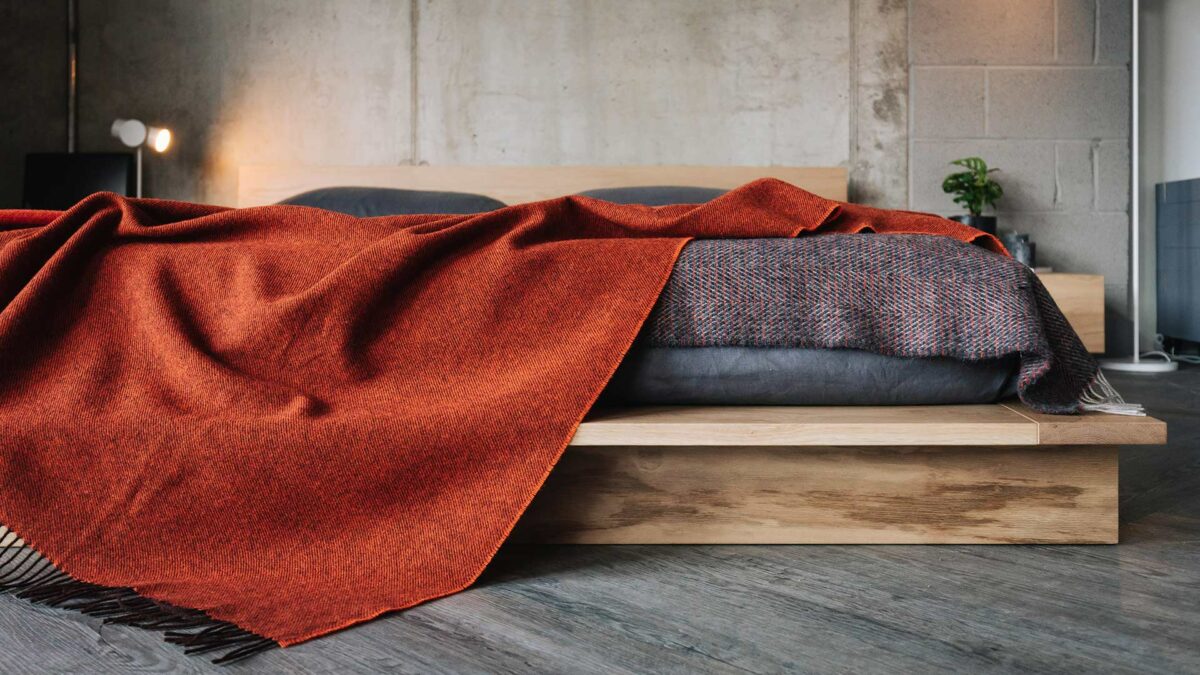 100% pure wool throw in orange with brown undertones