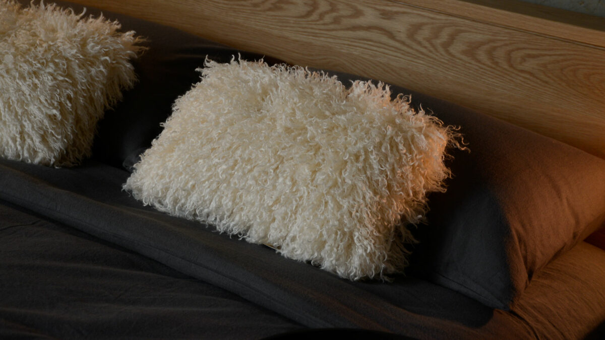 ivory curly faux sheepskin cushions