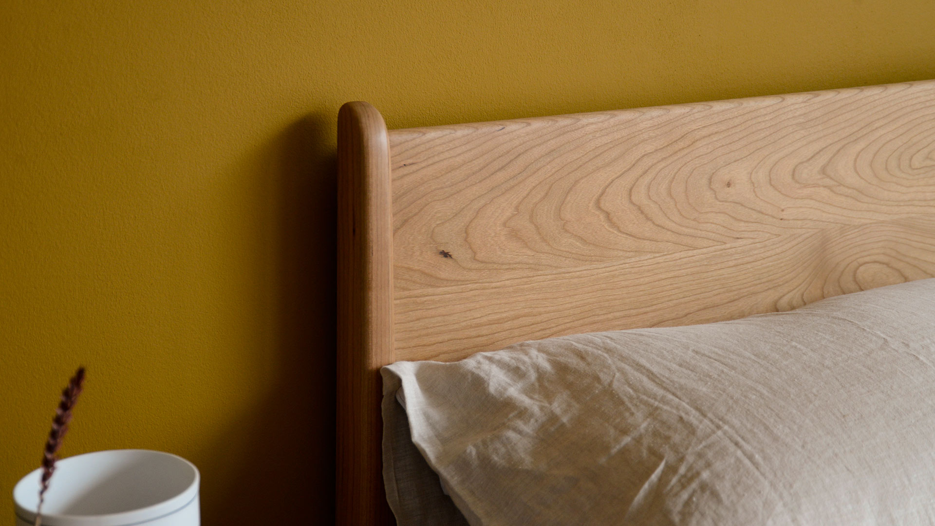 detail of cherry bed camden headboard