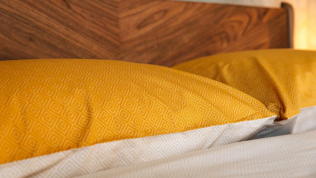 diamond pattern bedding in turmeric and ivory detail