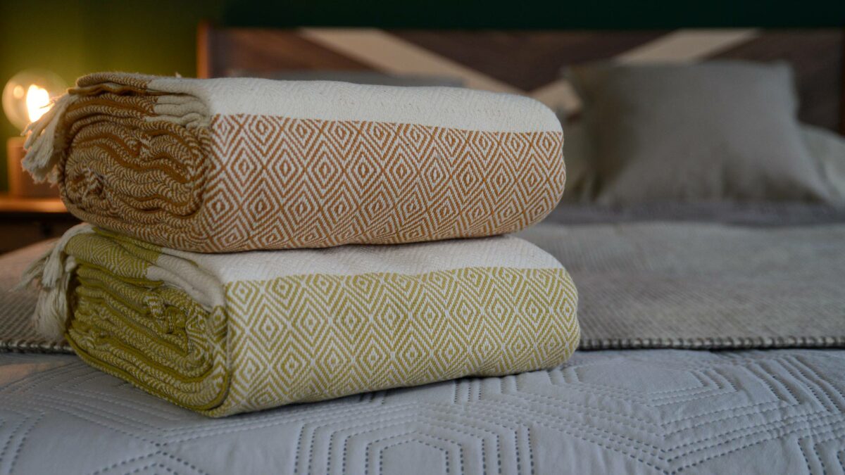 folded woven cotton blankets shown in close-up