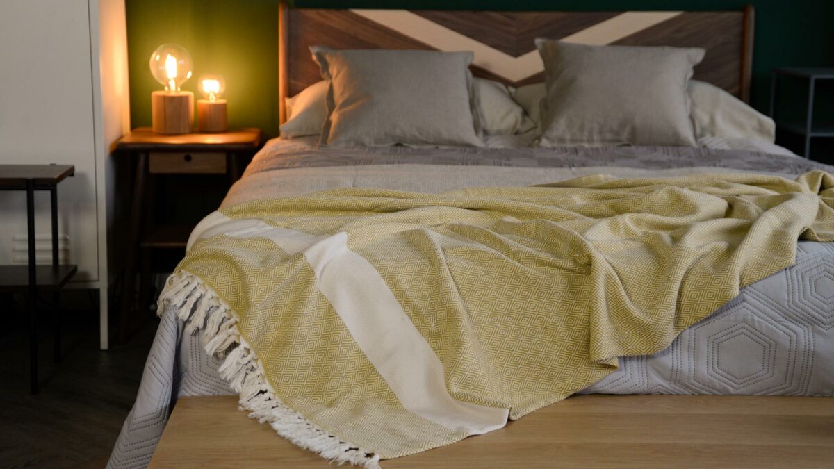 diamond pattern throw yellow with fringe over hoxton