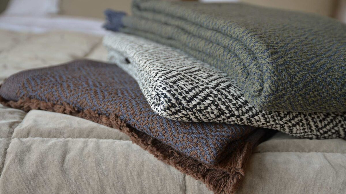 cotton rich woven diamond pattern throws in three colour options