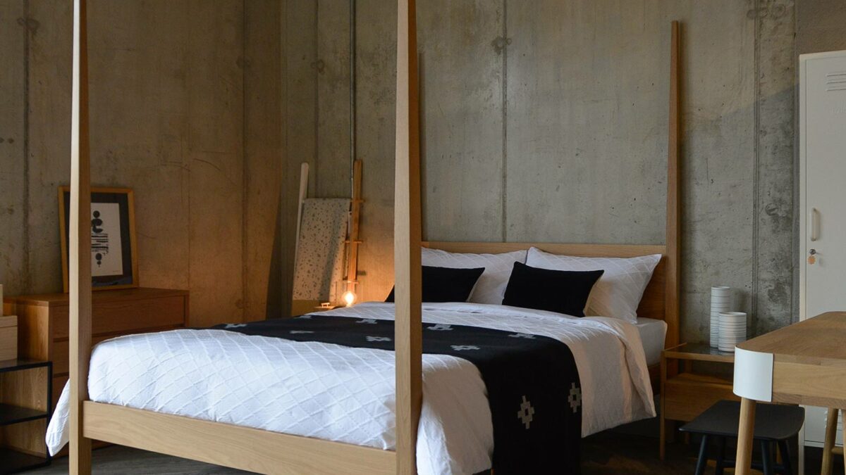 shown at an angle our 4 post Hatfield bed, a solid wood taller classic bed