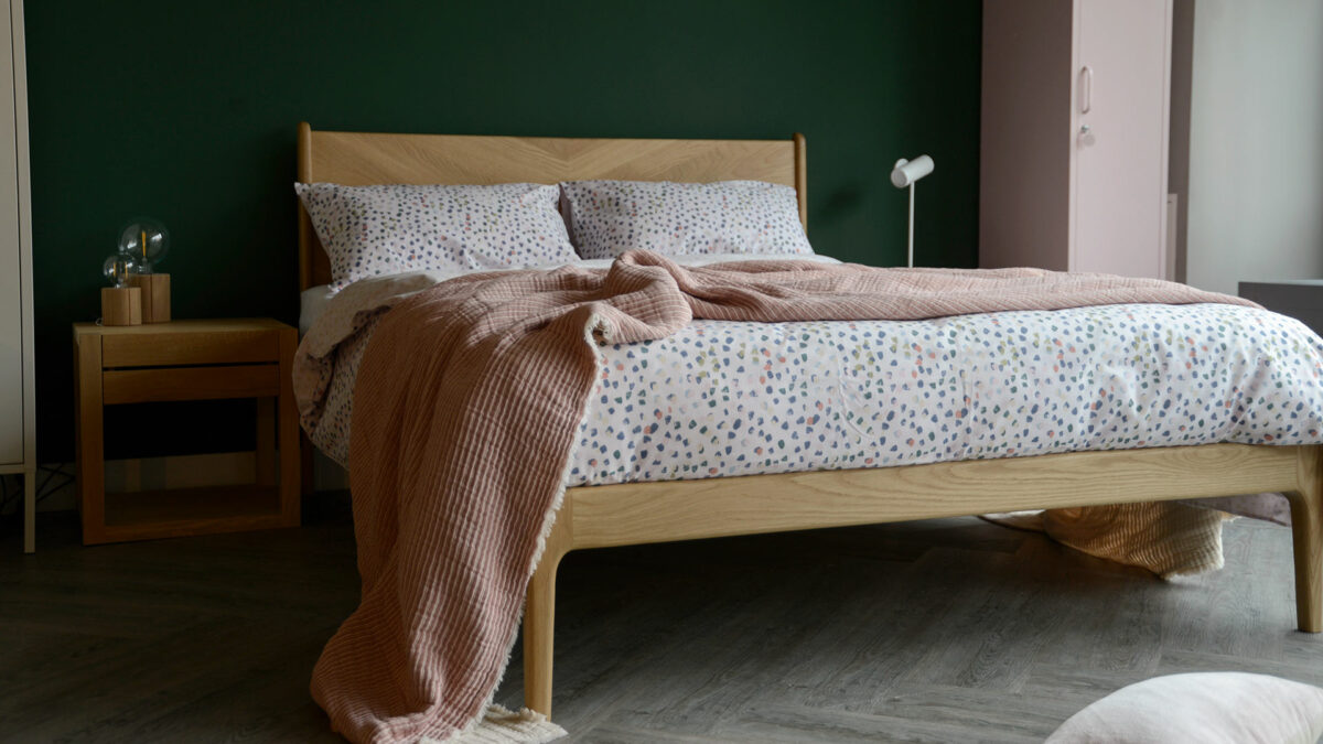 reversible cotton blend duvet cover set with pastel colours paint brush dots print and shown on oak Hoxton bed