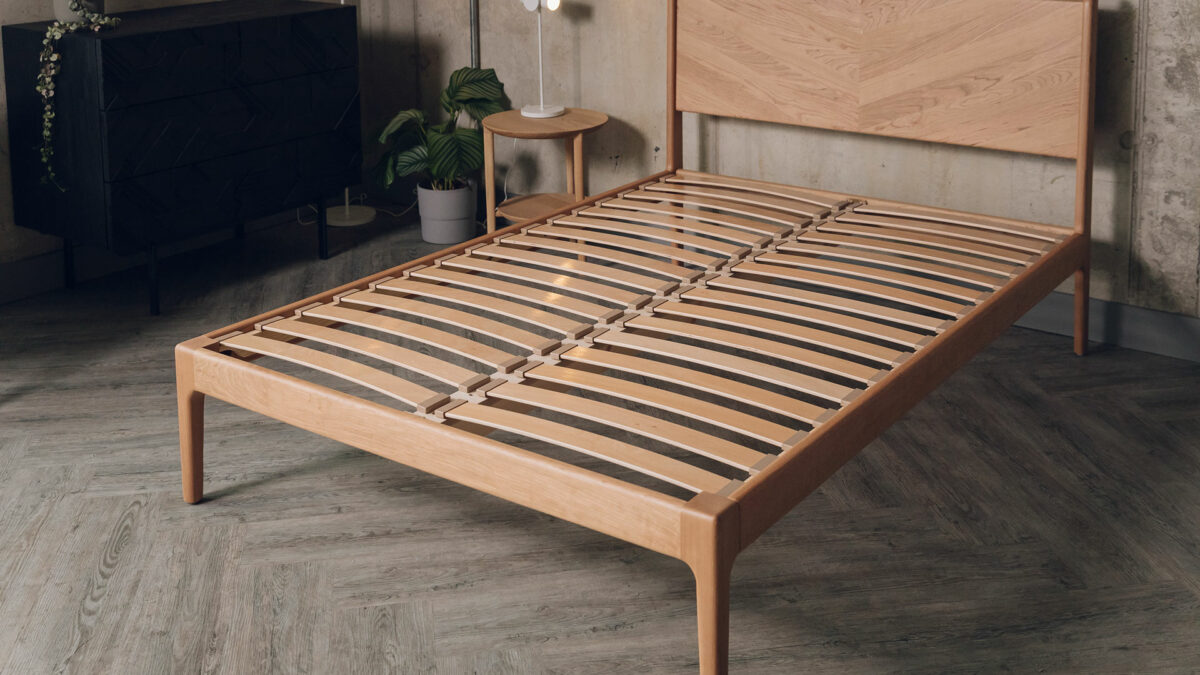 double size retro style cherry wood Hoxton bed shown without mattress