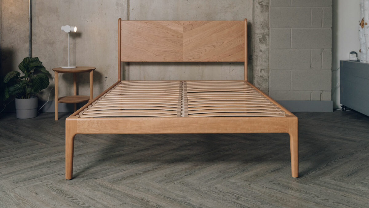 Double size cherry wood Hoxton bed shown without mattress