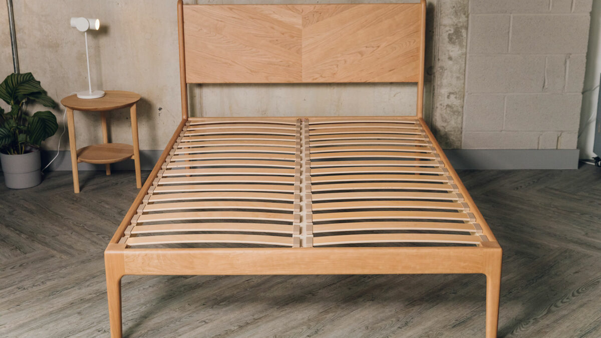 double size cherry wood Hoxton bed shown without mattress