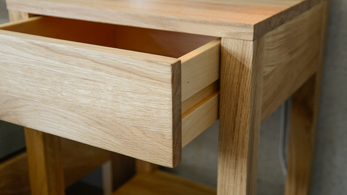 oak Bedside table with one drawer and an open shelf, drawer shown open