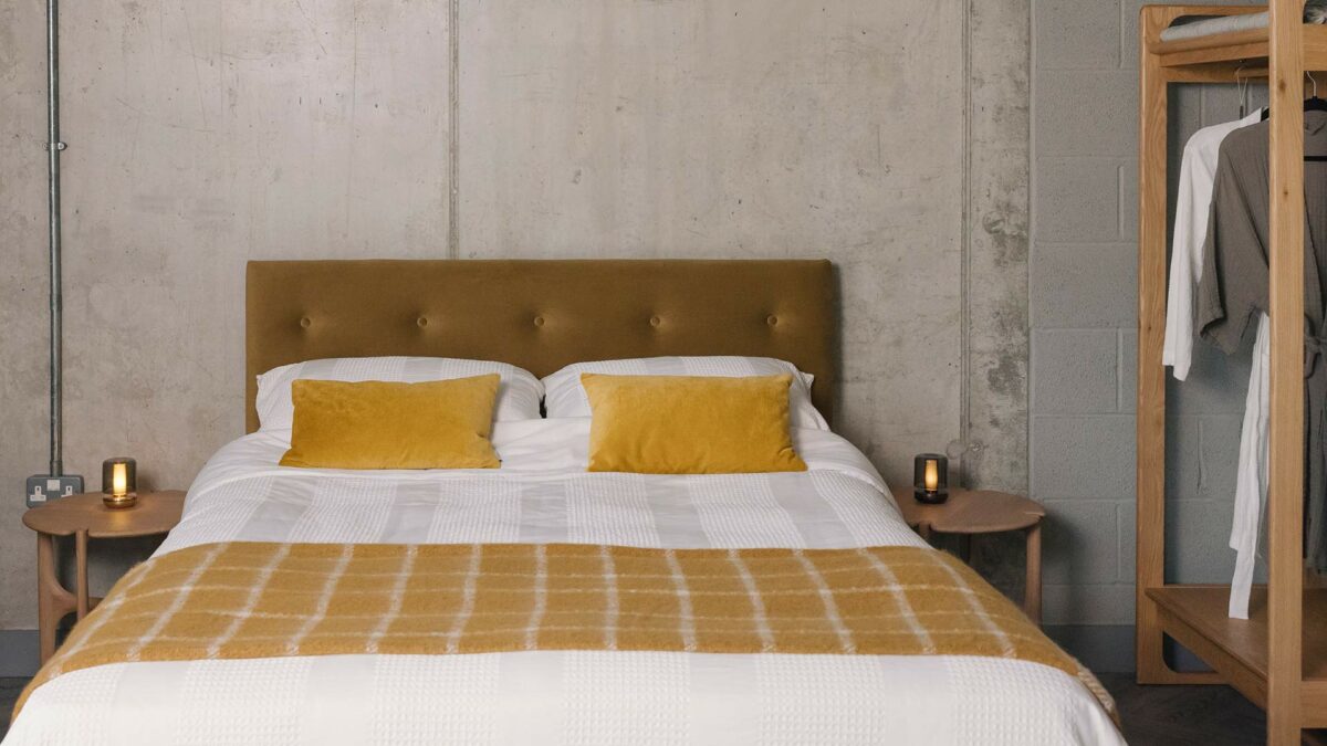eco velvet headboard with yellow bedding