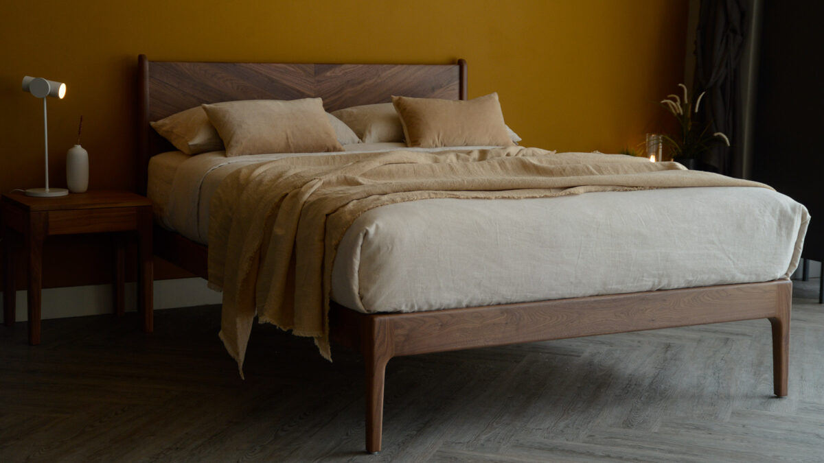 the Hoxton handcrafted solid wood bed with chevron pattern headboard here it is made in Walnut