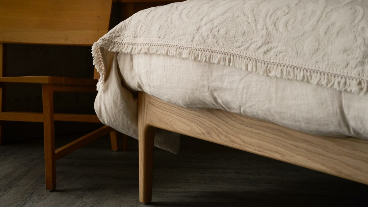 ecru linen bedding and embroidered throw carlisle bed leg in oak