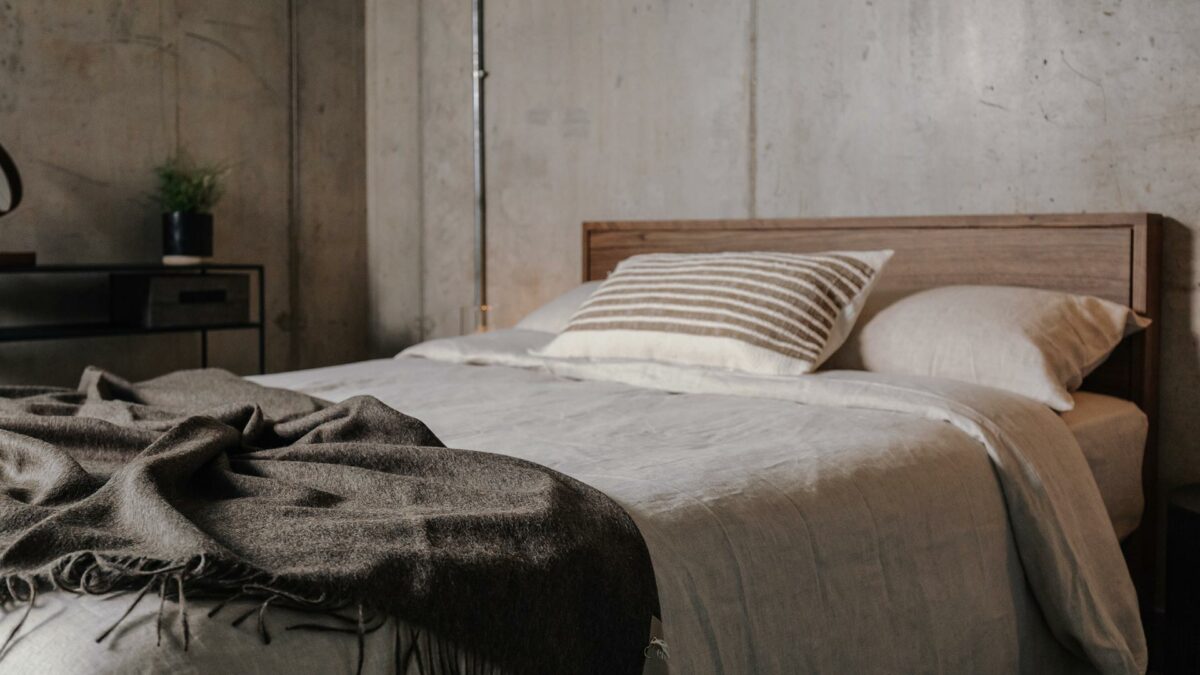 pale ecru linen bedding shown on our Leith walnut wood bed frame