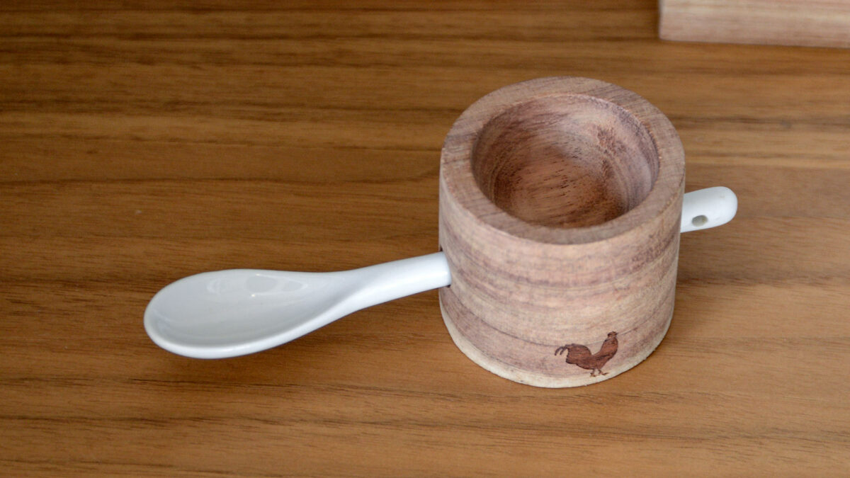 wooden egg cup with porcelain spoon