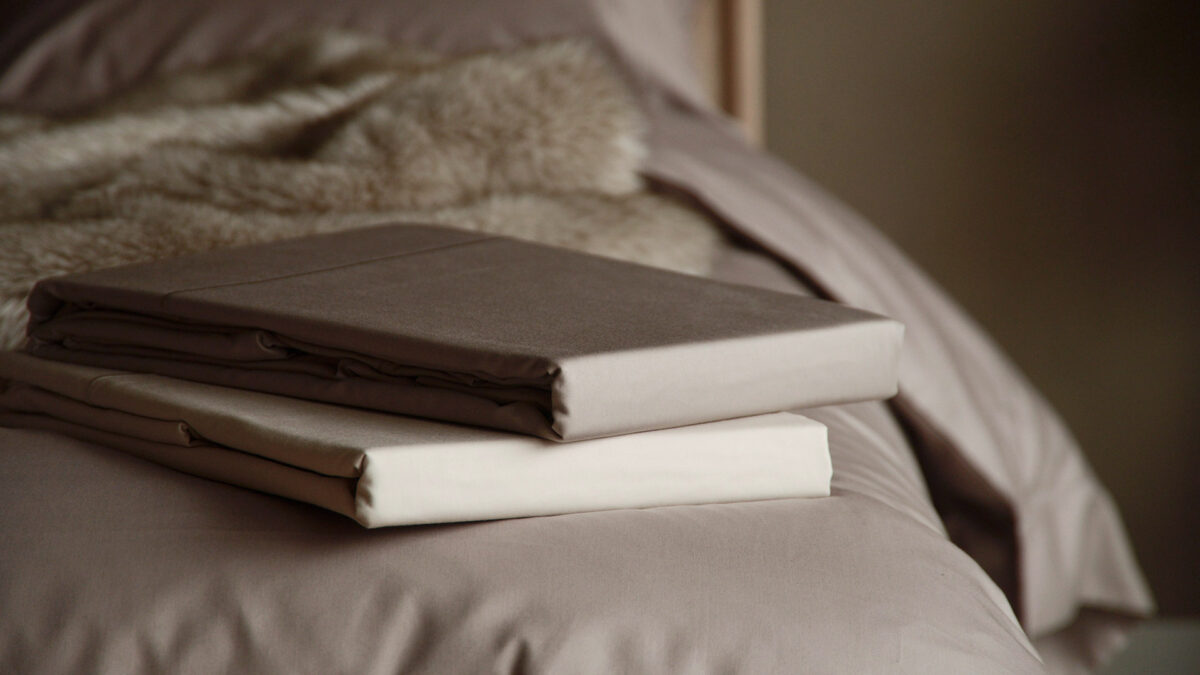 soft sheen 400 thread count Egyptian cotton bedding in shell and mink colours shown together in a stack