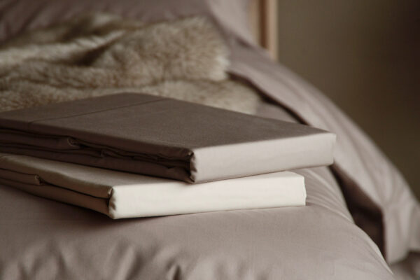 soft sheen 400 thread count Egyptian cotton bedding in shell and mink colours shown together in a stack