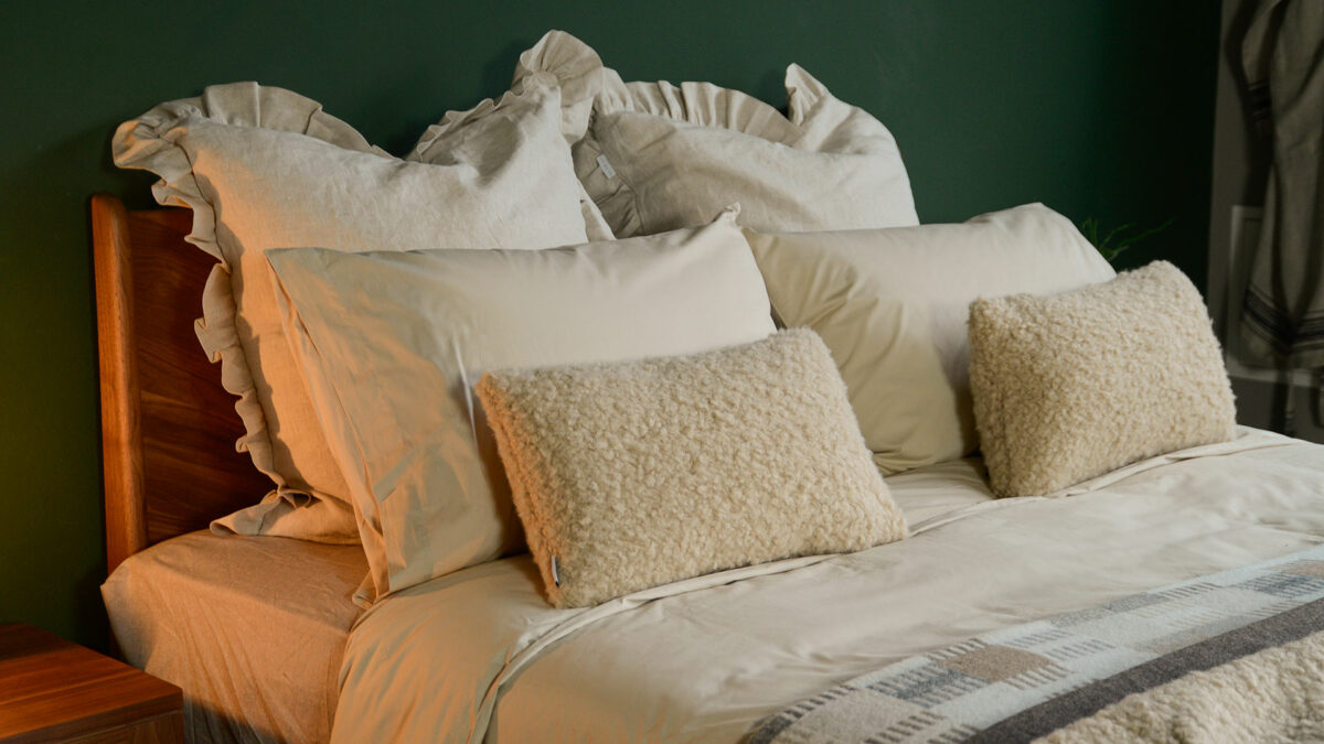 Egyptian cotton bedding with faux sheepskin cushions