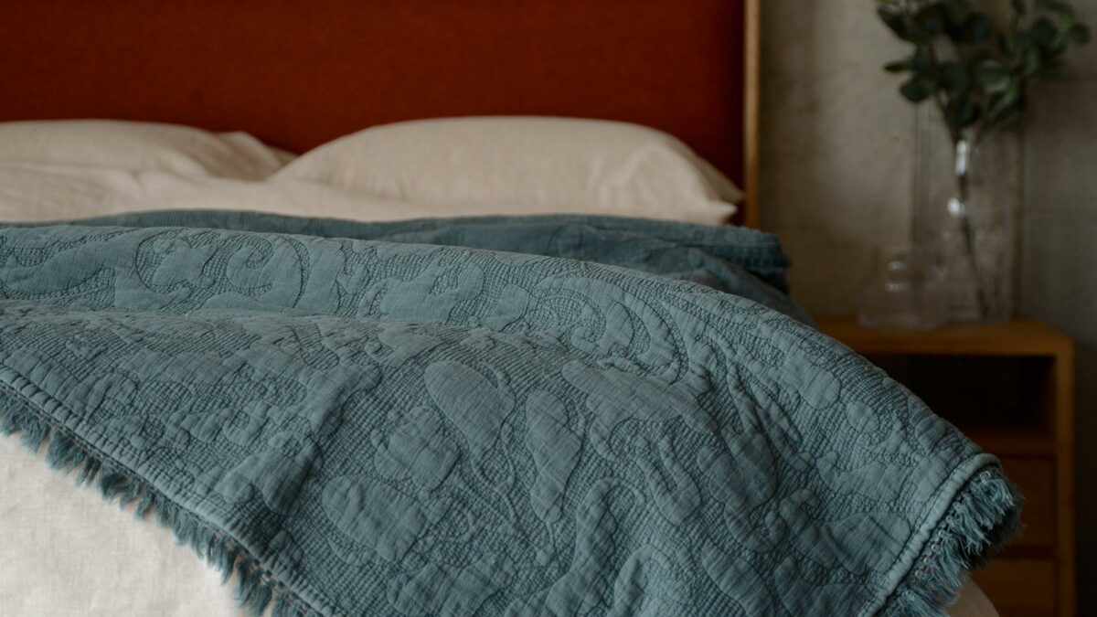 embroidered throw with fringe edge storm blue