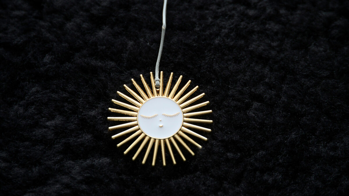 enamelled sun decoration
