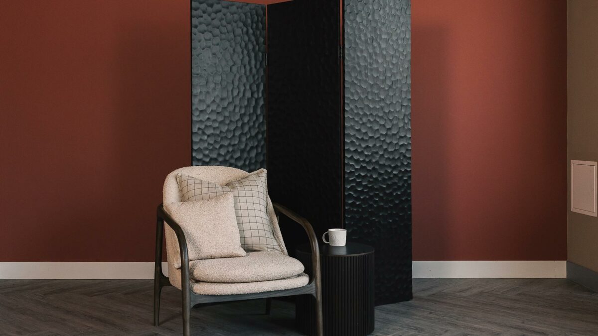 ethnicraft screen with boucle lounge chair and roller side table
