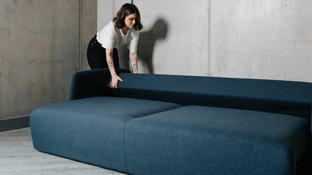 contemporary sofa bed being folded out to make a bed