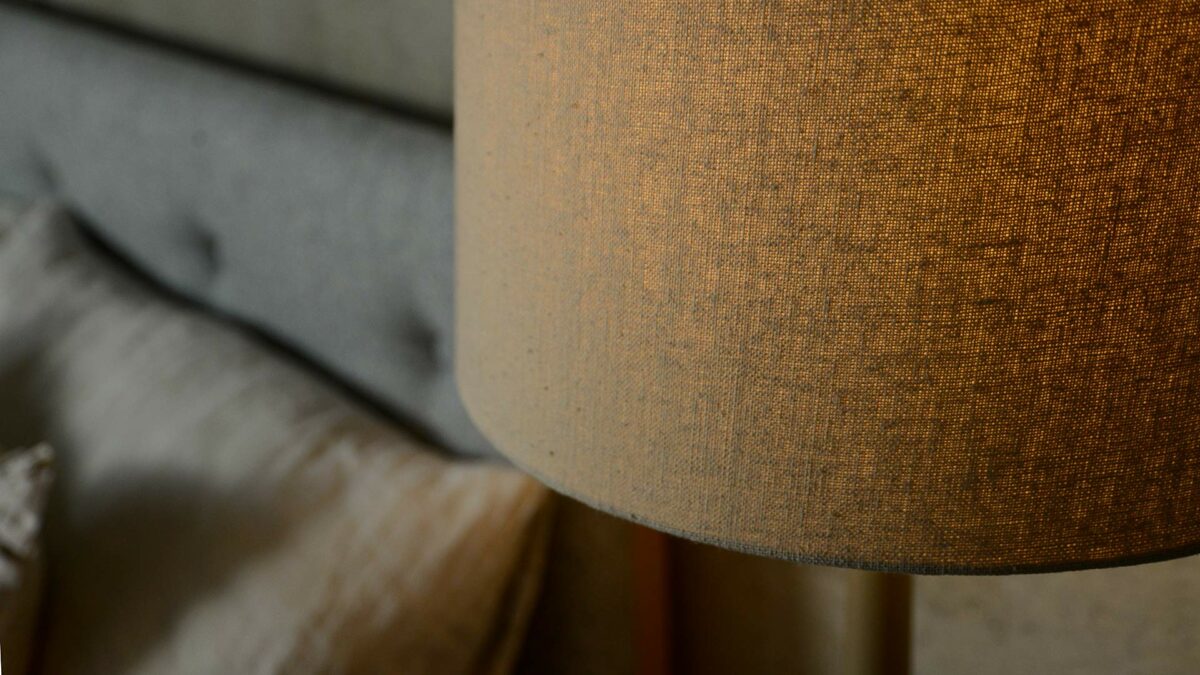 a painted wooden lamp base with linen colour shade a closer view of the shade