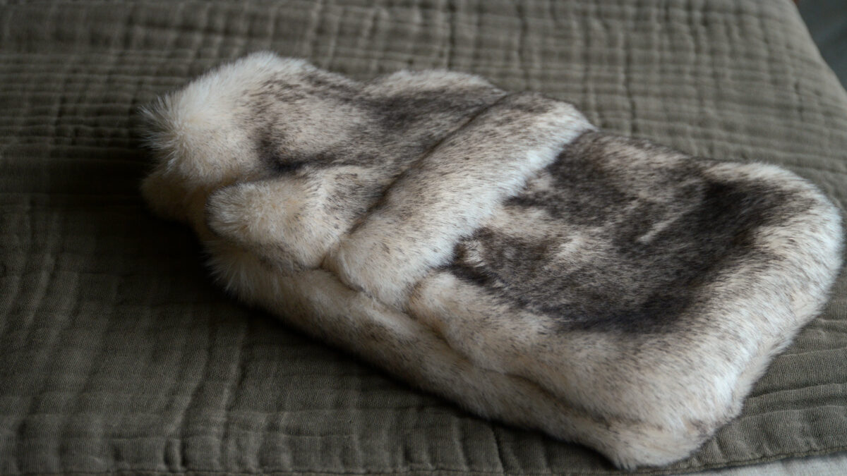 cosy iory and brown faux fur hot water bottle in snow fox