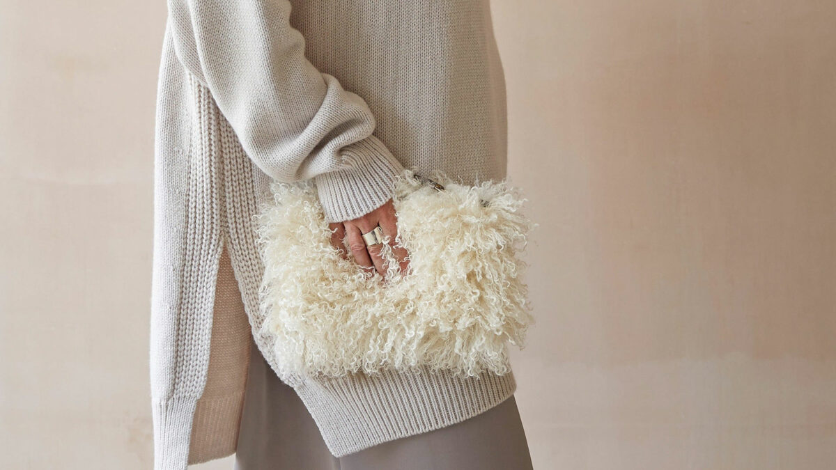 curly sheepskin effect faux fur clutch bag