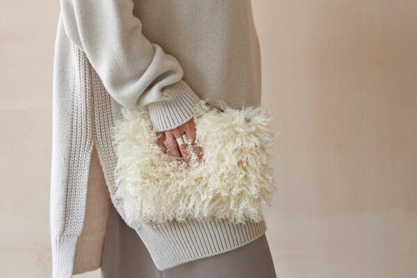 curly sheepskin effect faux fur clutch bag