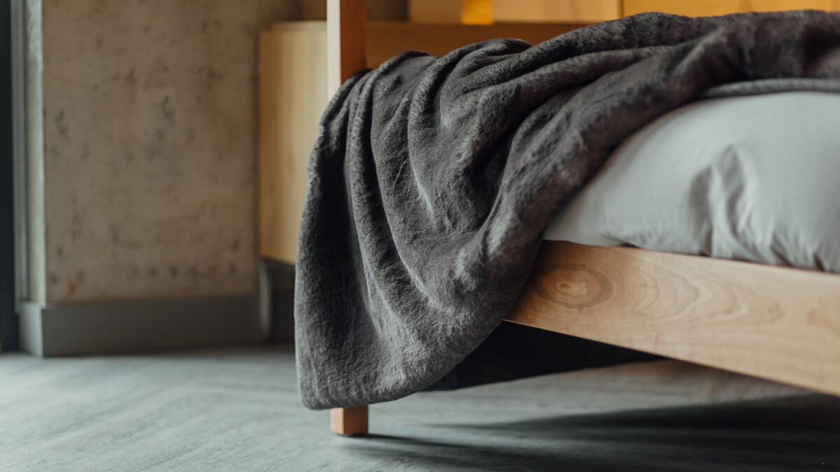 Highland bed with faux fur bedspread