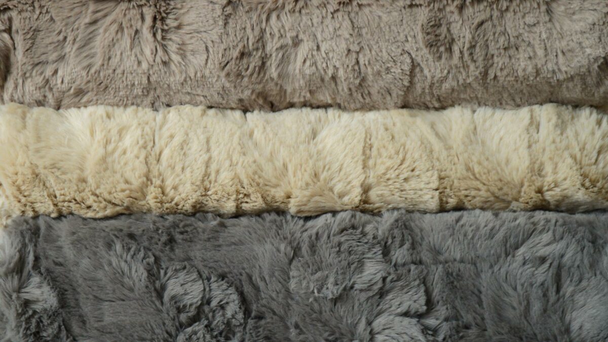 faux fur throws close up truffle caramel and mole grey