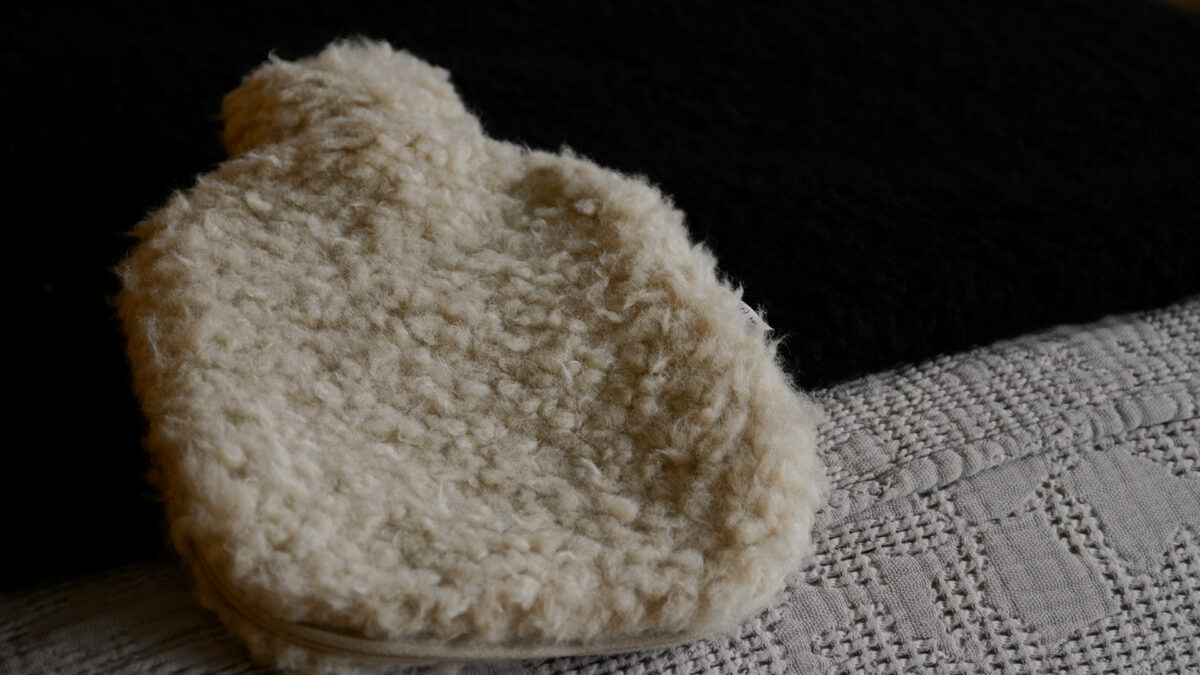 soft sheepskin effect hot water bottle in beige