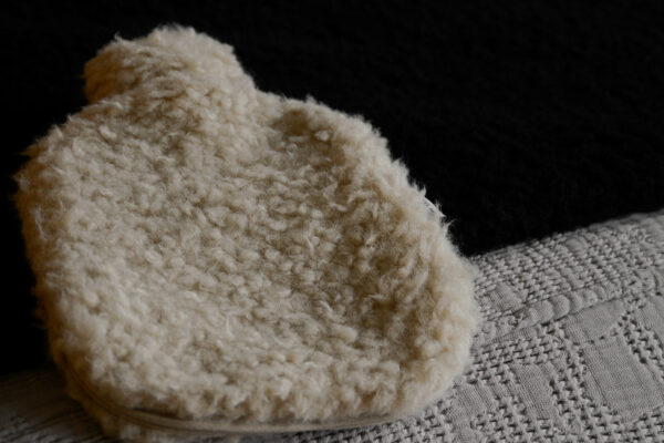 soft sheepskin effect hot water bottle in beige