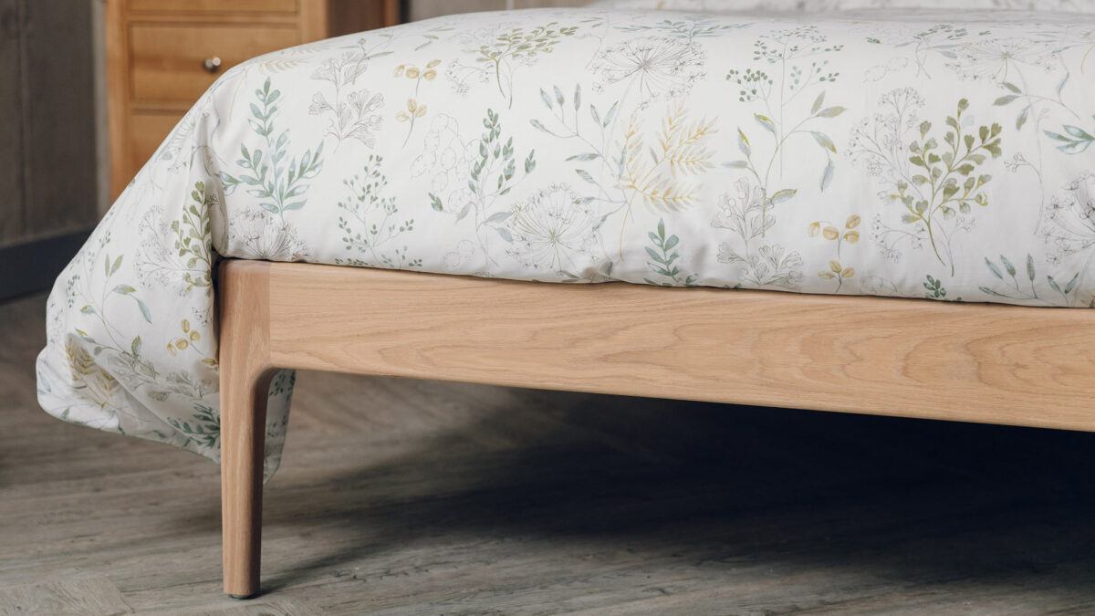 Oak Bloomsbury bed a close up of the oiled frame and leg at the foot end