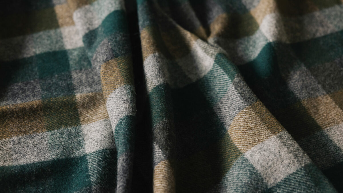 fir green khaki and grey check throw detail