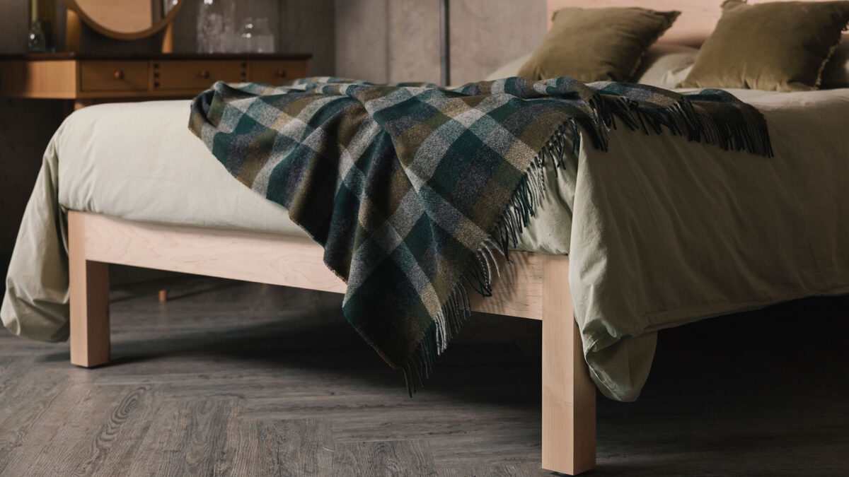 fir green olive and grey check throw on maple Bamford