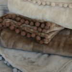 fleecey mini pom pom throws