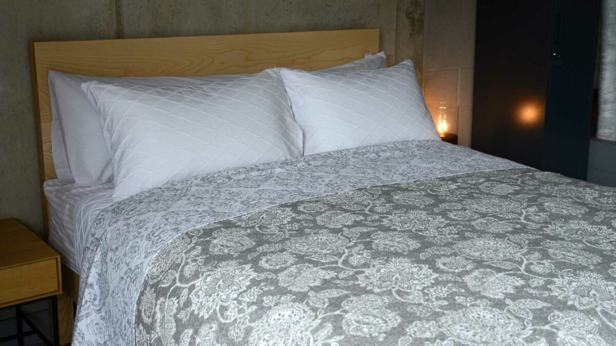 grey and white floral print reversible quilted bedspread