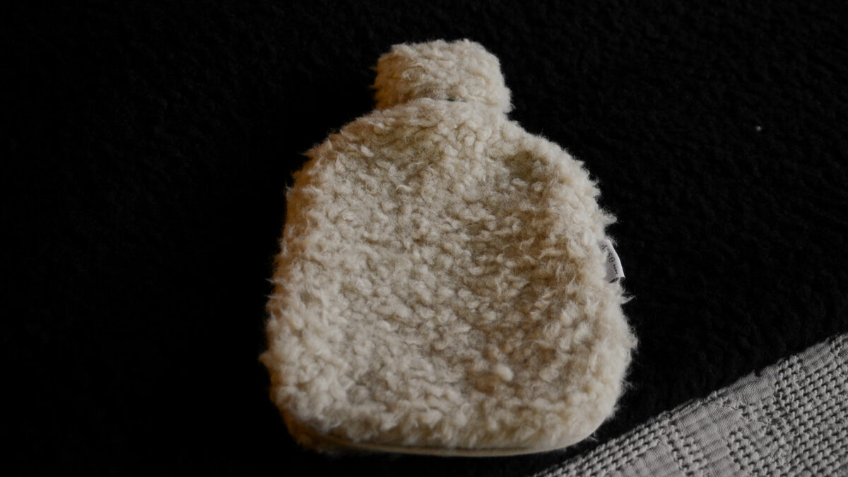 fluffy and cosy faux sheepskin hot water bottle