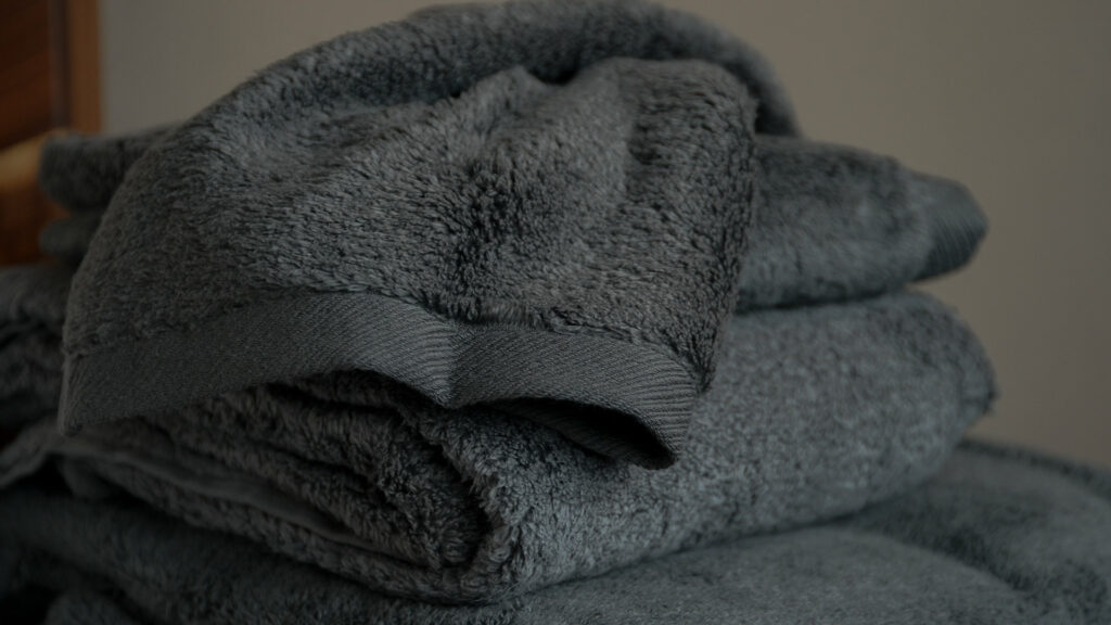 soft and fluffy bathroom towels in charcoal grey