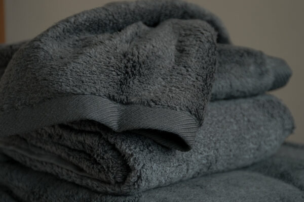 soft and fluffy bathroom towels in charcoal grey