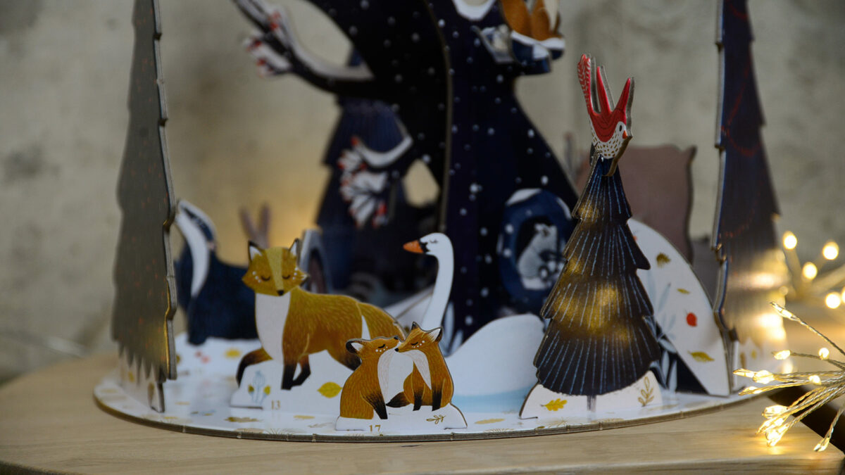 3D advent calendar with wildlife in a snowy scene including a family of foxes