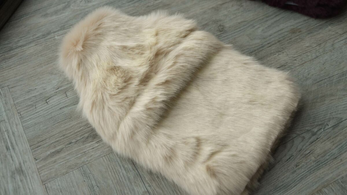 luxury softest faux fur hot water bottle in a pale beige colour