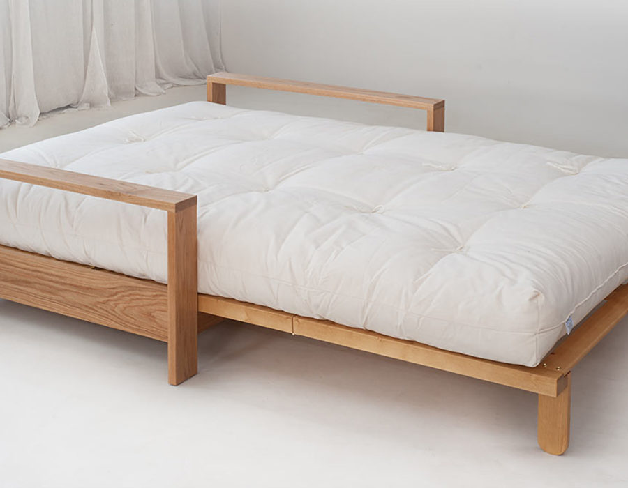 Our Oak Panama sofa-bed showing it folded out for a bed with Futon mattress