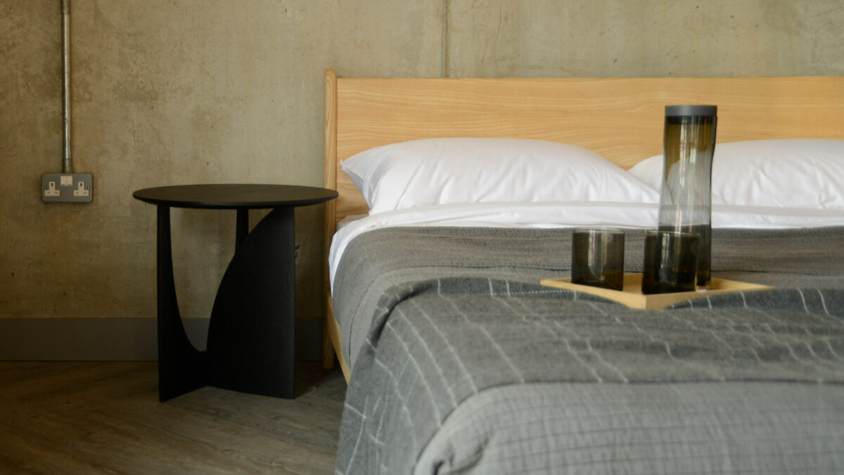 geoemtric side table with carnaby bed and blomus glassware