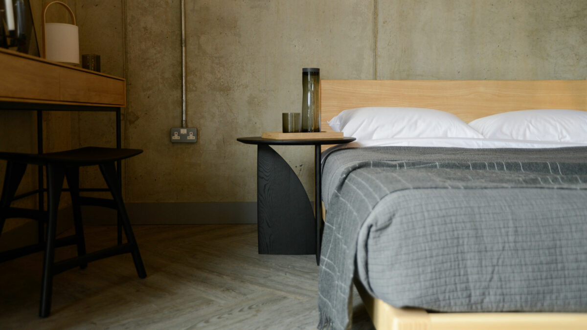 geometric side table next to Carnaby bed