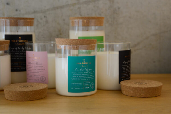 moments inspired scented candles in a glass jar with a cork lid that can be used as a coaster