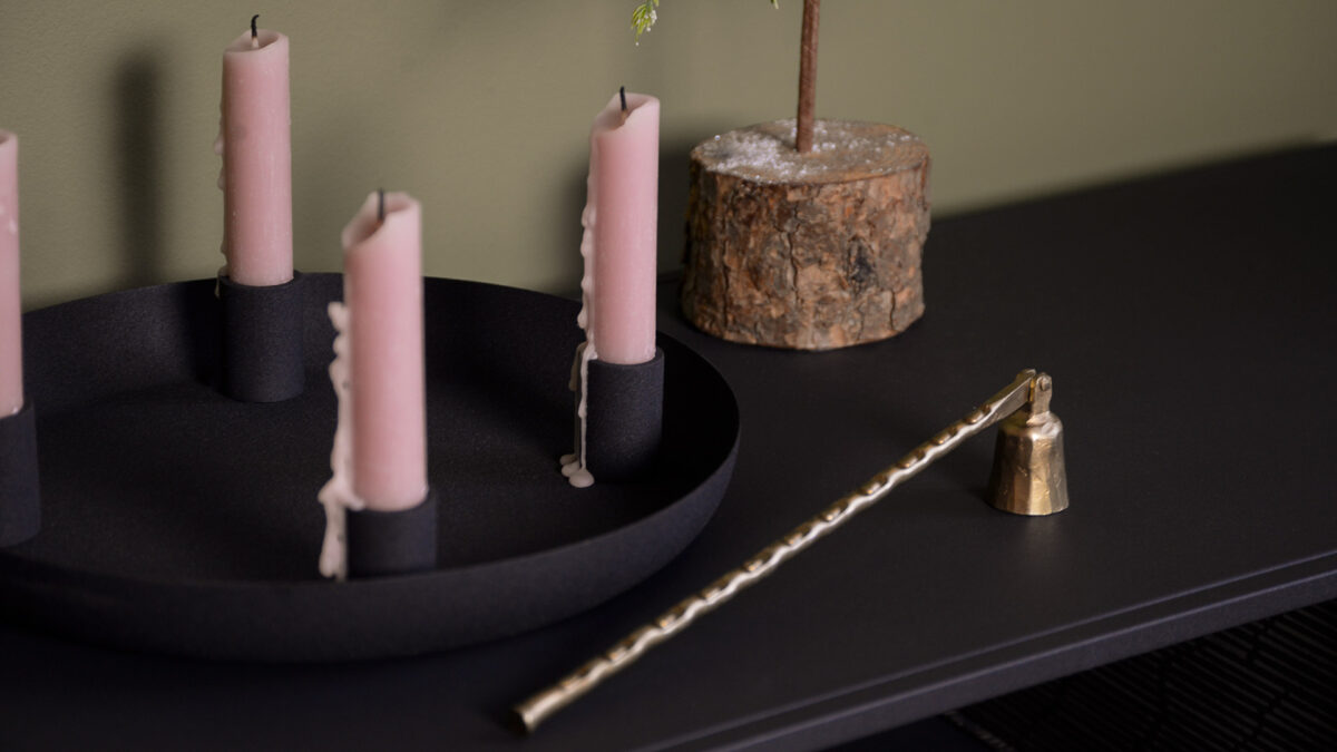 gold candle snuffer and black candle holder bowl