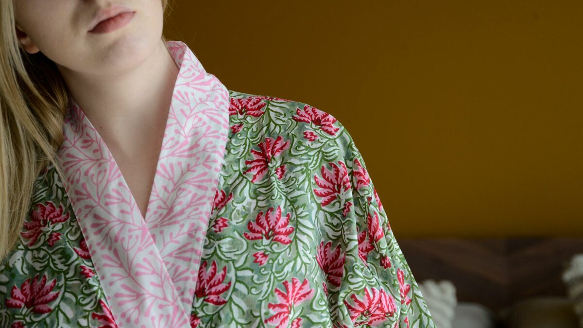 lightweight cotton robe with a vibrant pink and green block print design and contrast collar and cuffs